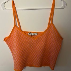 This is a bright orange neon summer top from Zara in a size L